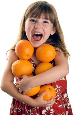 little-girl-holding-oranges